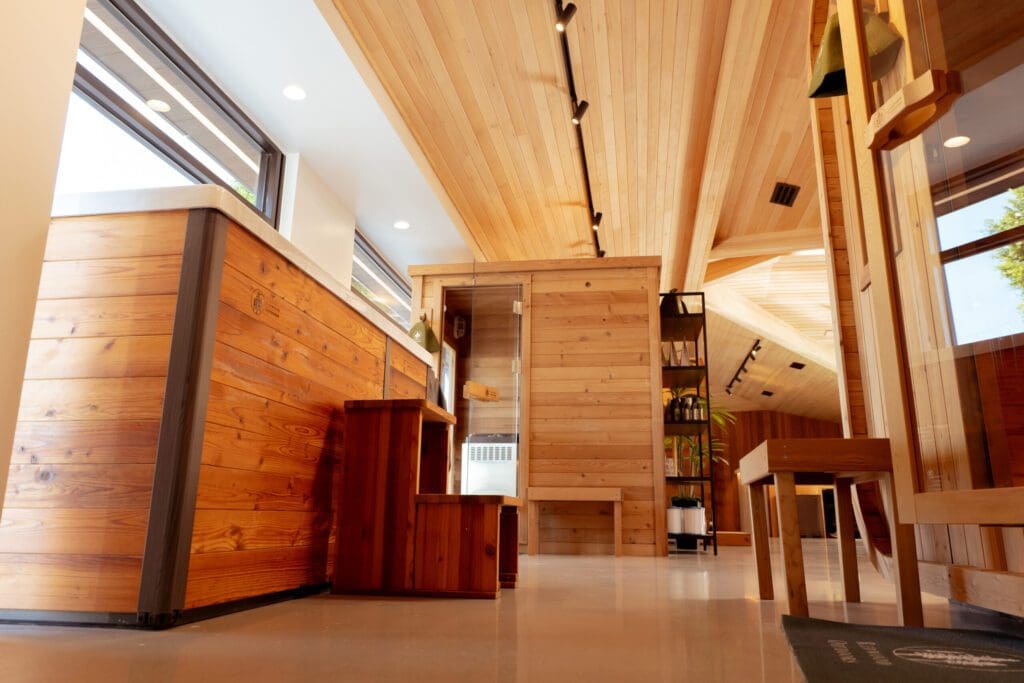 Modern interior with wooden furniture and ceiling.